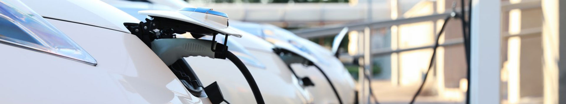 Photo of a car plugged in a charging station