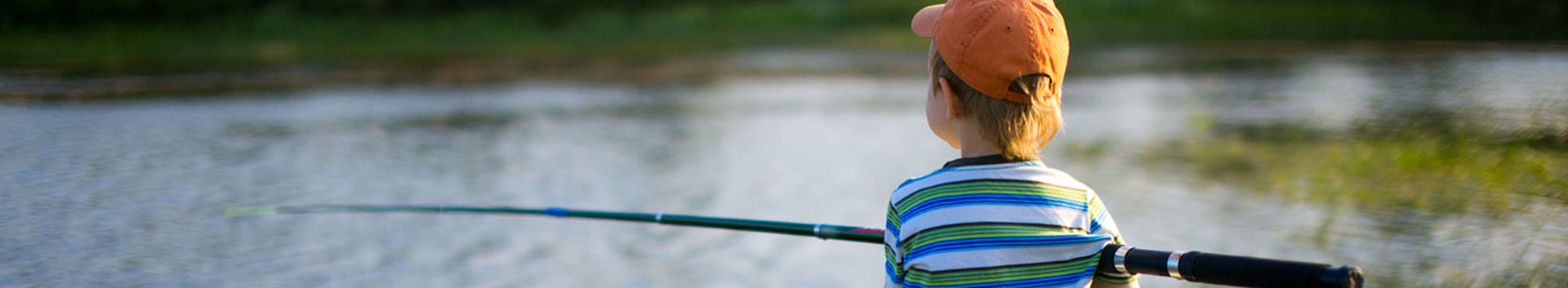 photo of boy fishing