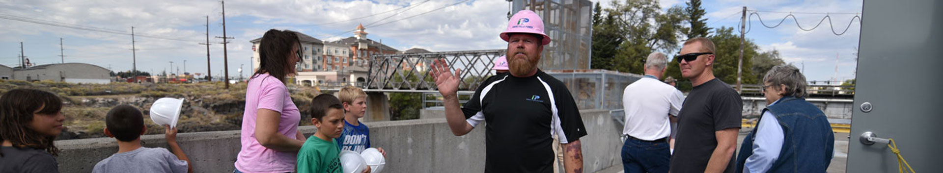 photo of worker waving during a tour