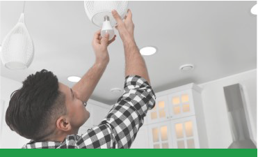 Man installing an LED lightbulb