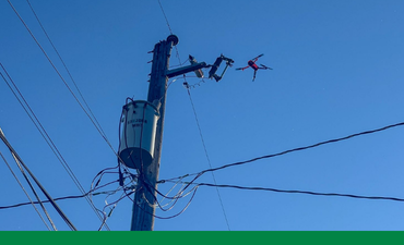 Drone with power pole and wires